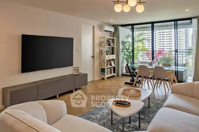 Modern living room with elegant decor and spacious balcony view