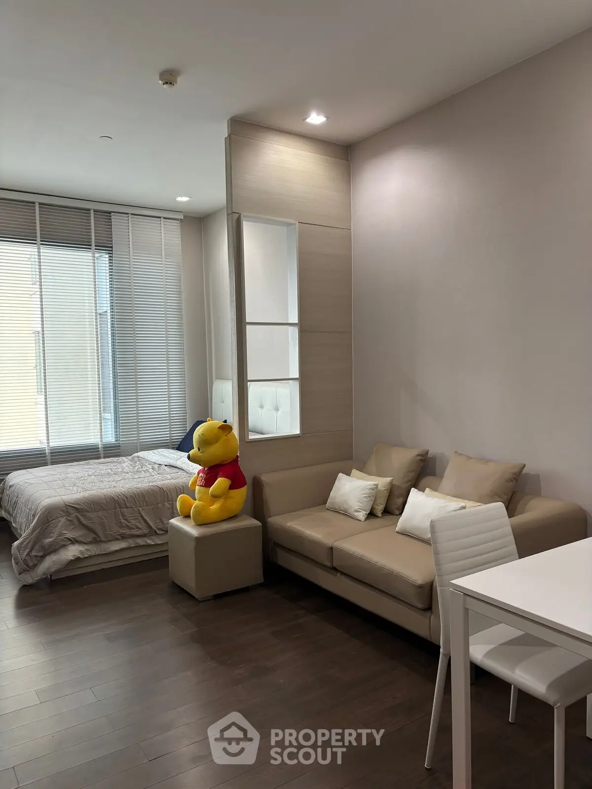 Modern studio apartment with cozy living area and stylish decor