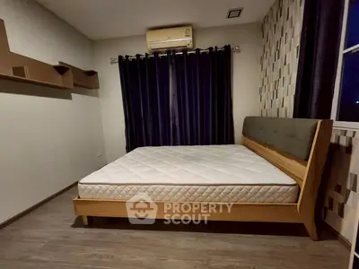 Modern bedroom with stylish bed and dark curtains