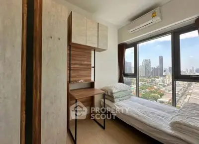 Modern bedroom with city view, featuring sleek wooden furniture and large windows for natural light.