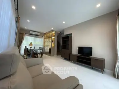 Spacious modern living room with elegant decor and ample natural light