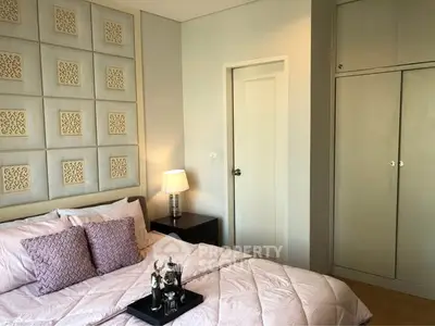 Elegant bedroom with stylish decor and ample storage space