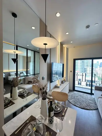 Modern living room with dining area and balcony view in a stylish apartment