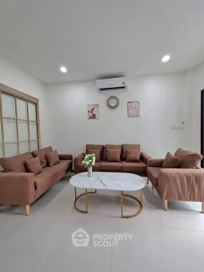 Stylish living room with modern brown sofas and elegant coffee table