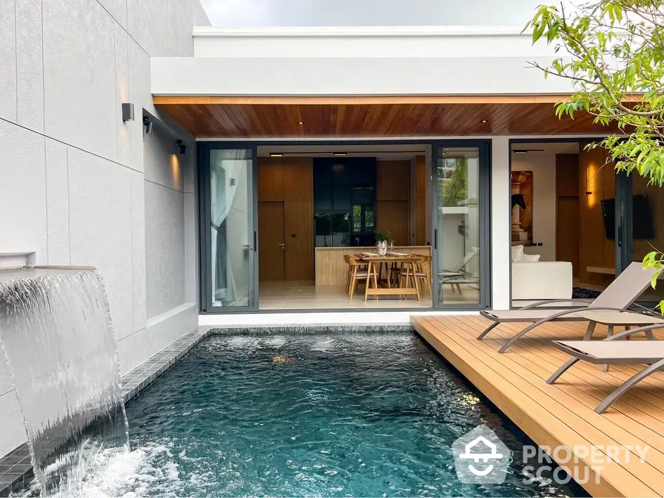 Luxurious modern home with private pool and stylish wooden deck