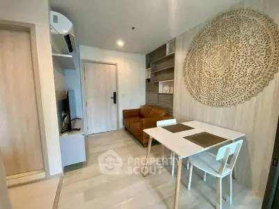 Modern living room with stylish decor and dining area in a cozy apartment.