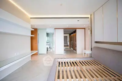 Spacious modern bedroom with sleek design and ample storage space