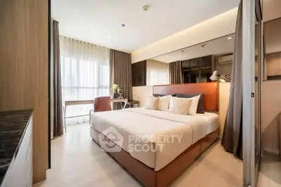 Luxurious modern bedroom with large window and elegant decor