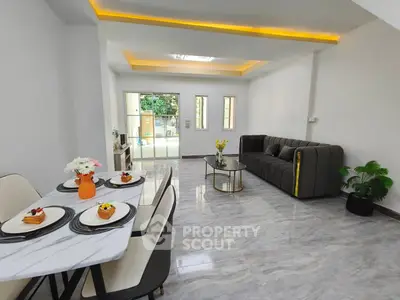 Spacious modern living room with elegant dining area and stylish decor