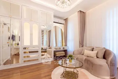 Luxurious living room with elegant decor and mirrored cabinets
