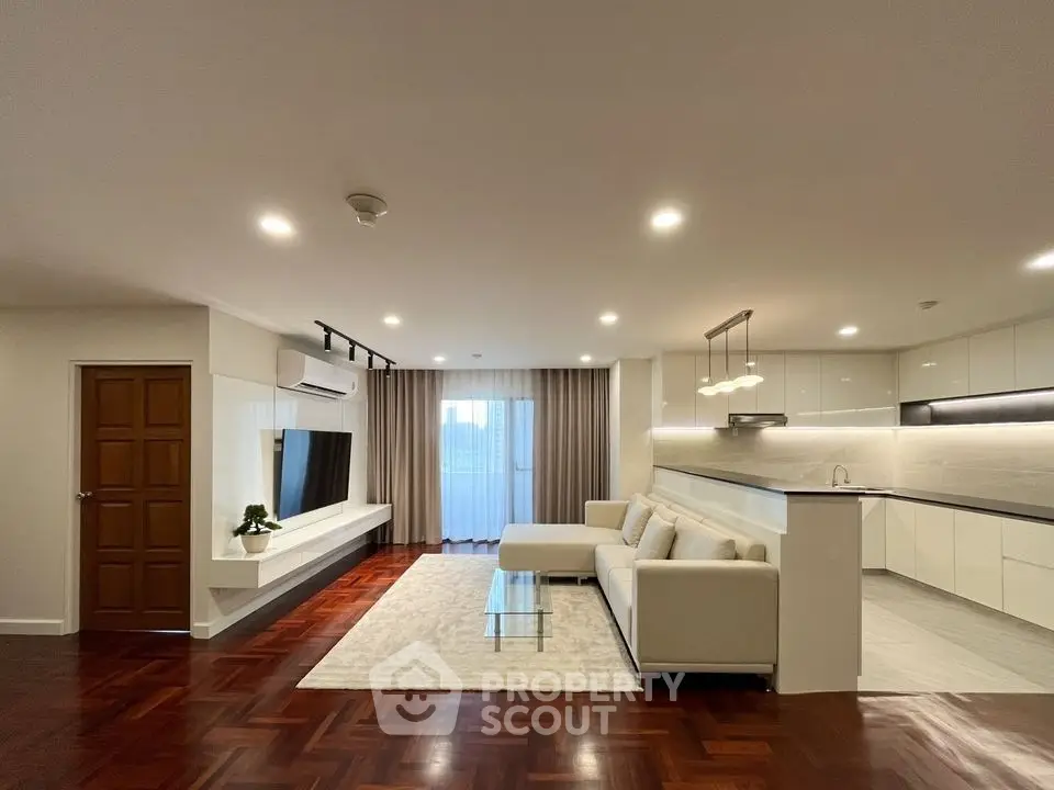 Spacious modern living room with open kitchen and elegant decor