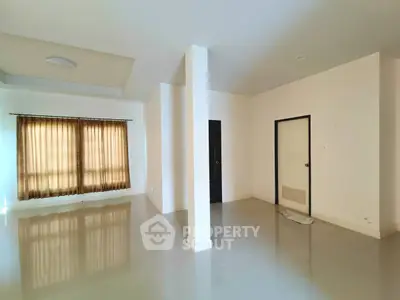 Spacious empty room with glossy tiled floors and large window with curtains, ideal for customization.