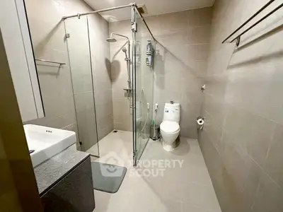 Modern bathroom with glass shower and sleek fixtures