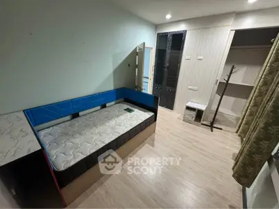 Spacious bedroom with modern design and ample storage space