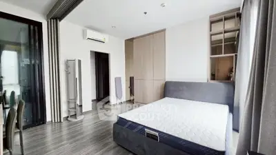 Modern bedroom with sleek design and ample natural light