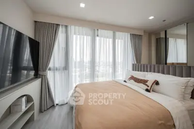 Modern bedroom with large window and stylish decor in a luxury apartment