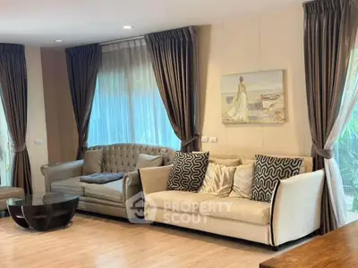 Elegant living room with plush sofas and stylish decor, perfect for modern living.