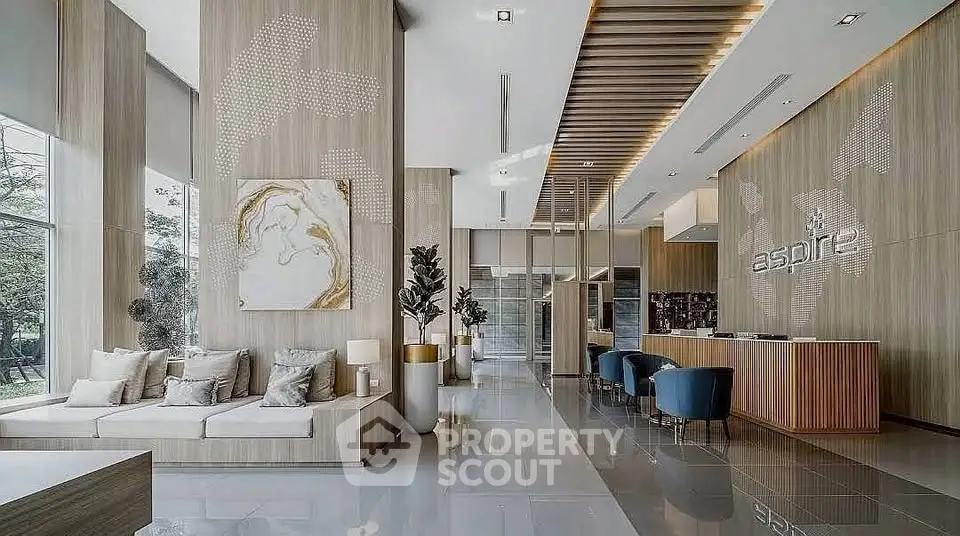 Luxurious modern lobby with elegant seating and stylish decor in a high-end residential building.