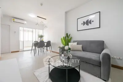 Modern living room with stylish decor and open dining area