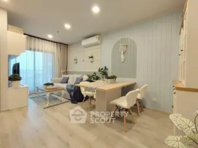 Charming open-plan living and dining area with modern decor and natural light.