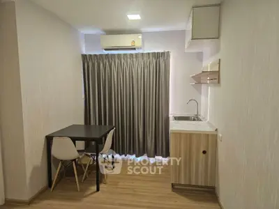 Modern compact kitchen with dining area and air conditioning