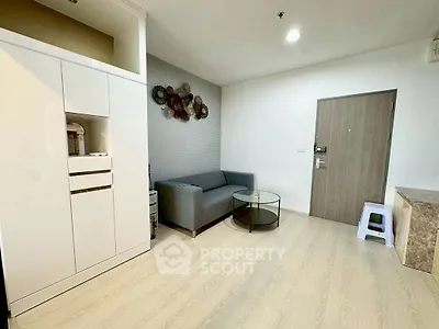 Modern living room with sleek furniture and stylish decor in a contemporary apartment.