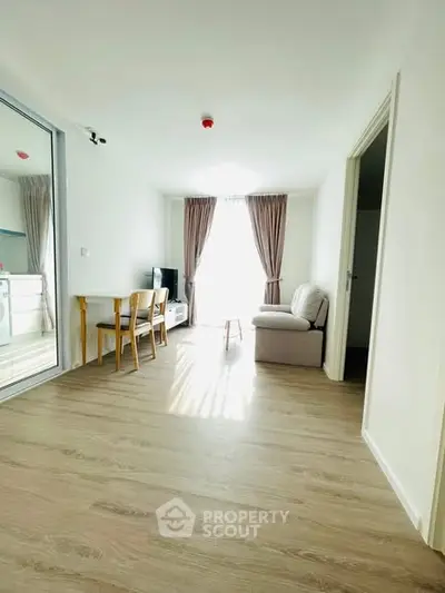 Bright and airy living room with modern furnishings and natural light.