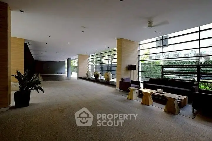 Spacious modern lobby with stylish seating and large windows