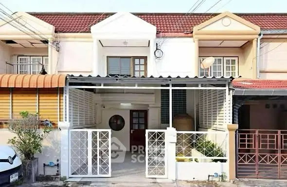 Charming townhouse with gated entrance and covered parking in a serene neighborhood.