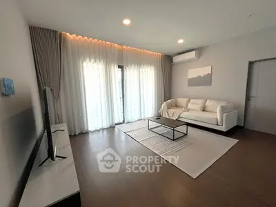 Spacious modern living room with elegant decor and natural light