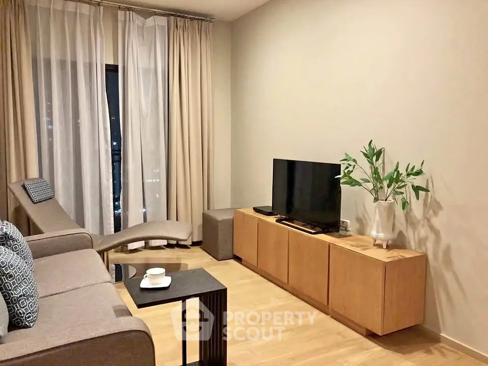 Stylish modern living room with cozy seating and elegant decor, perfect for relaxation and entertainment.
