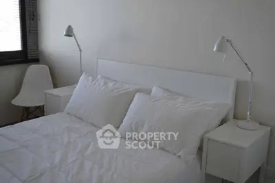 Modern minimalist bedroom with white decor and stylish lamps