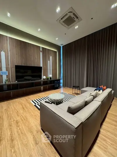 Luxurious modern living room with stylish decor and cozy seating area.