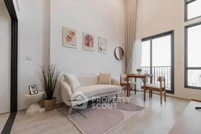 Modern living room with stylish decor and large windows offering city views.