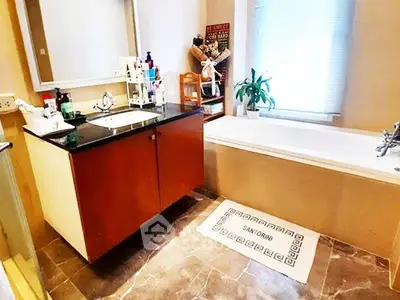 Modern bathroom with sleek design and bathtub in a stylish home.