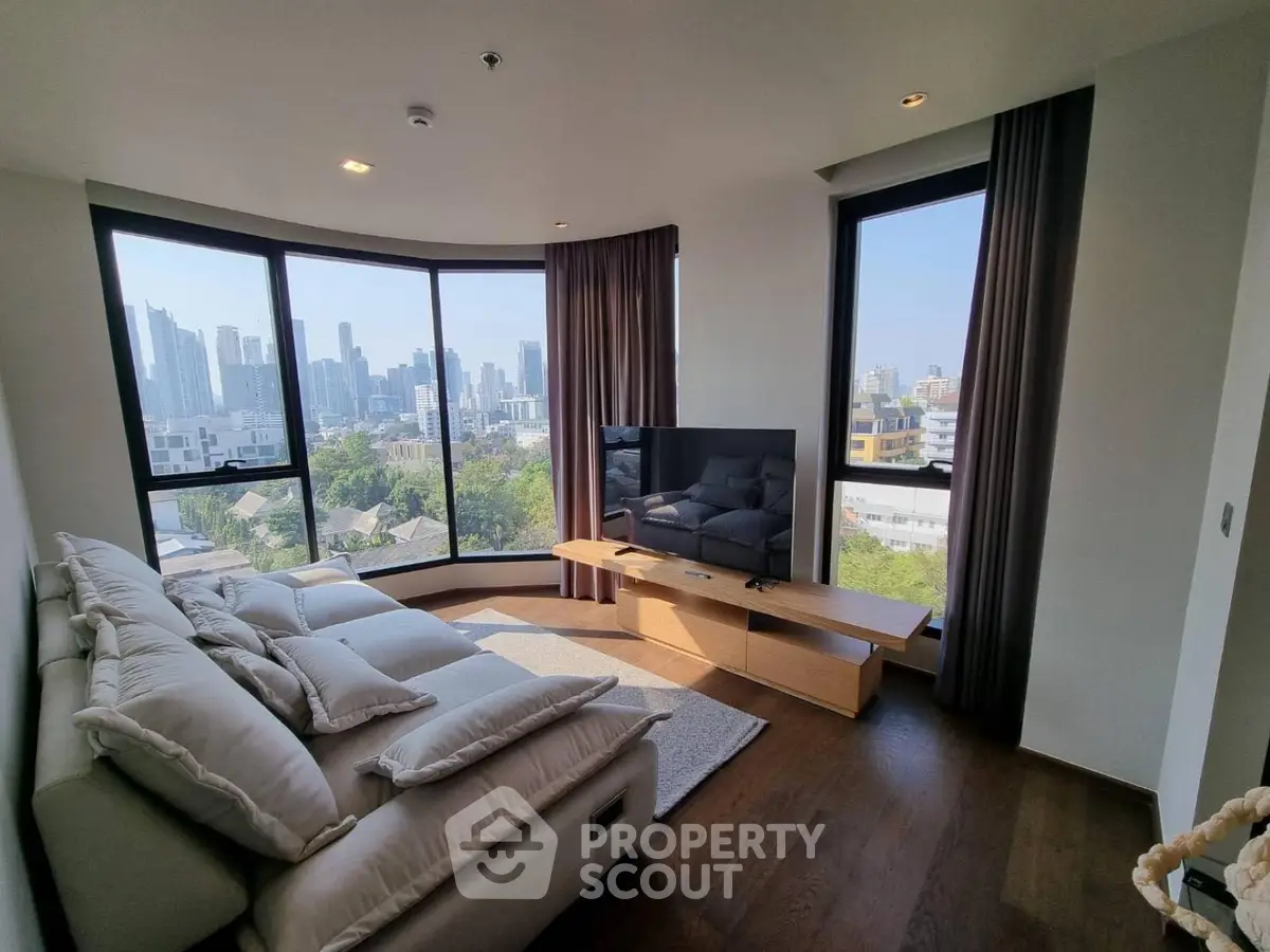 Luxurious living room with panoramic city views and modern furnishings
