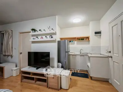 Modern open-plan living room with sleek kitchen and stylish decor