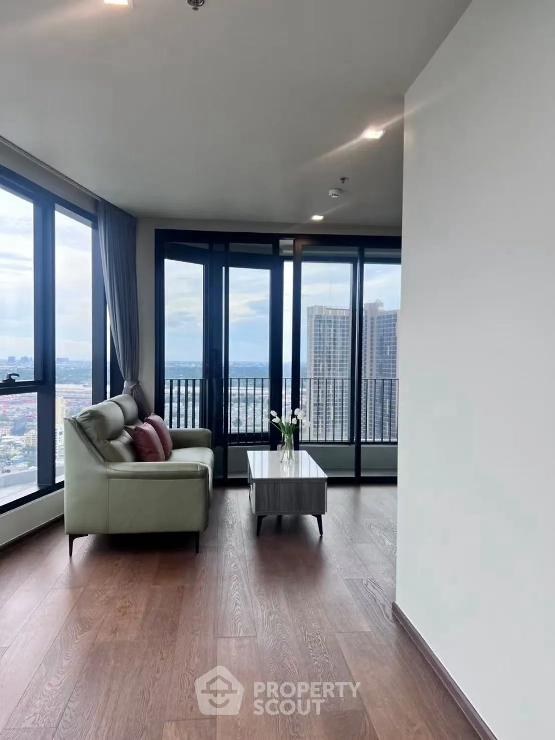 Modern living room with panoramic city view and elegant decor