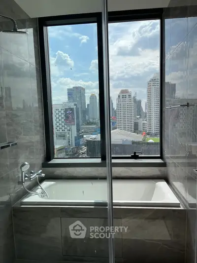 Luxurious bathroom with stunning city view from large window