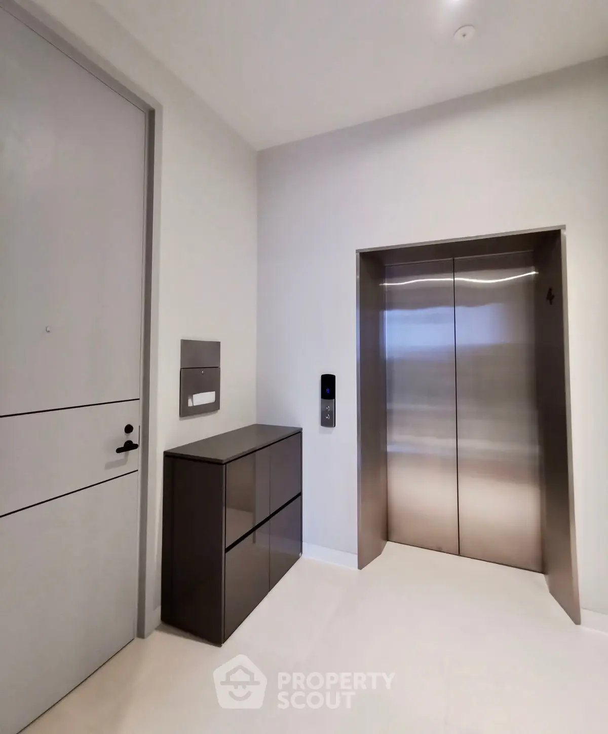 Modern building elevator lobby with sleek design and contemporary finishes.