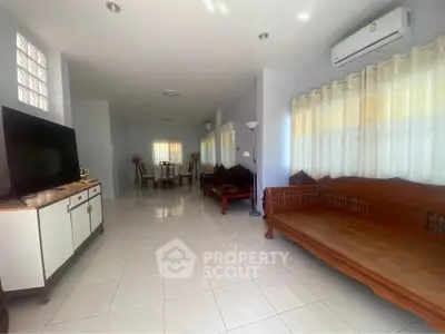 Spacious living room with elegant wooden furniture and modern decor