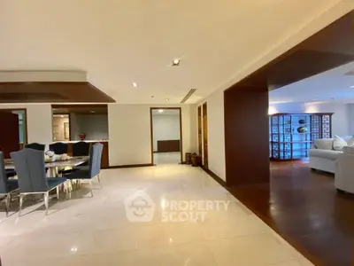 Spacious open-plan living and dining area with elegant furnishings and modern design.