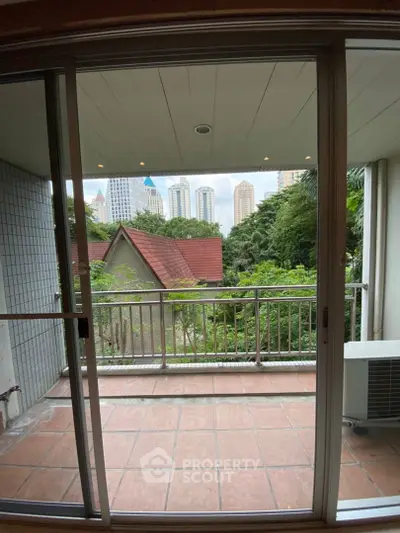 Spacious balcony with city view, perfect for relaxation and enjoying the urban skyline.