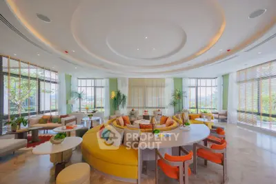 Luxurious and spacious living room with modern decor and panoramic windows.