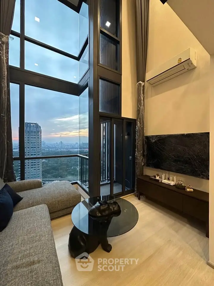 Luxurious high-rise living room with stunning city view and modern decor