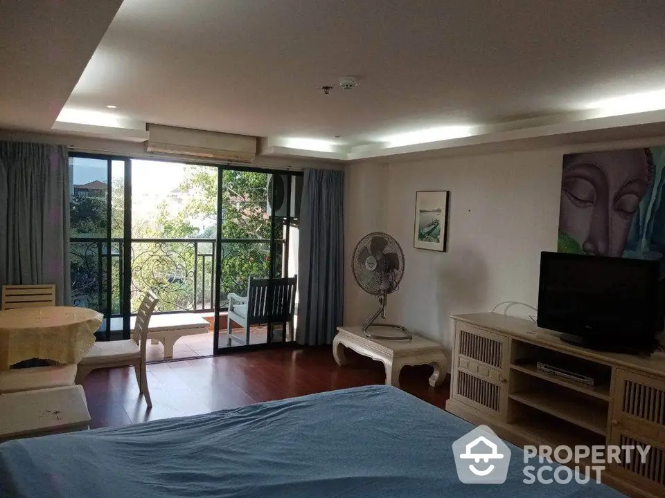 Spacious living room with balcony and modern decor