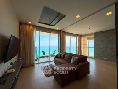 Luxurious living room with ocean view and spacious balcony in modern apartment