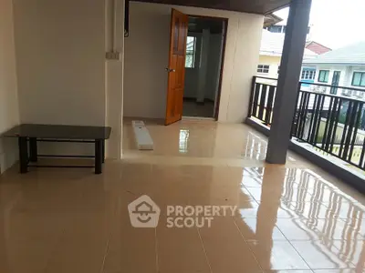 Spacious balcony with tiled flooring and open view, perfect for relaxation.