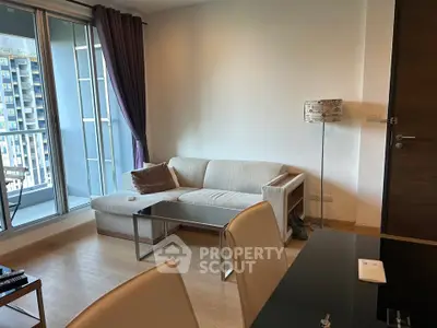 Modern living room with cozy sofa and balcony view in urban apartment