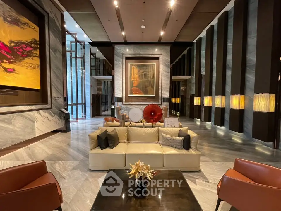 Luxurious modern lobby with elegant seating and art decor, perfect for upscale living.